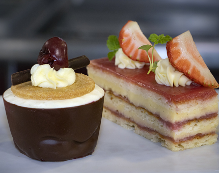 Miniatures from Fingal's Afternoon Tea: Poached cherries and white chocolate mousse and strawberry opera cake.