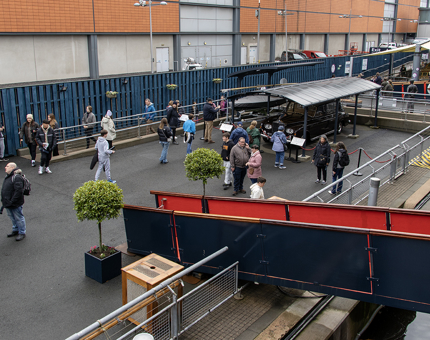The Royal Brow on the Quayside at Britannia. There are lots of visitors looking at the Rolls Royce.