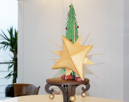 The finished chocolate sculpture of a Christmas tree and large star. 