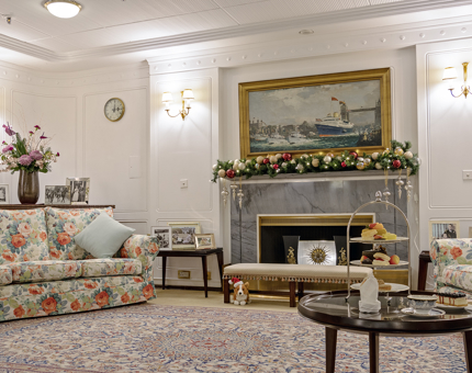 The State Drawing Room inside Britannia with a festive garland adorning the fireplace.