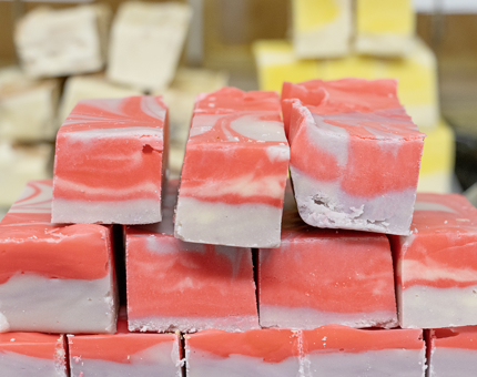 Bars of pink and white striped fudge.