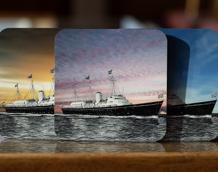 A set of drinks coasters with an illustration of The Royal Yacht Britannia.
