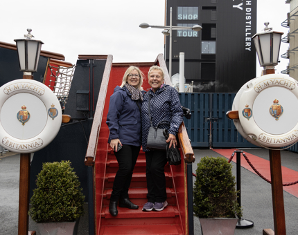 A man and a woman standing at the foot of the Royal Brow at The Royal Yacht Britannia.