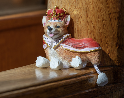 A novelty Corgi dog fridge magnet with dangly legs. 