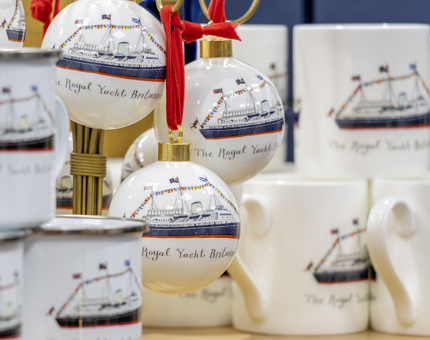 Britannia illustrated mugs, cups and hanging bauble decorations.