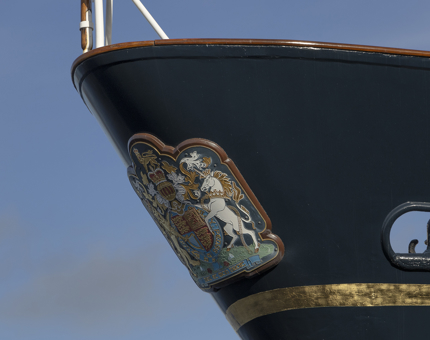 The bow of Britannia displaying the Royal Coat of Arms.