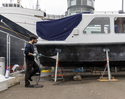 Washing down a Fast Motor Launch boat