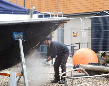 Washing down a Fast Motor Launch boat