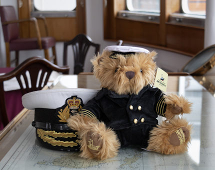 A cuddly Captain Bear and hat in the Chart Room.
