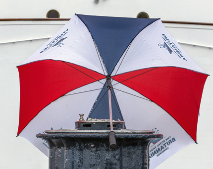 A red, navy and white Britannia umbrella. 