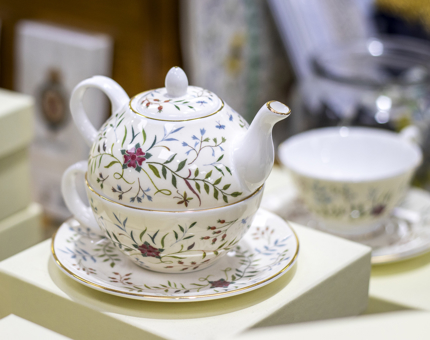 A teaset with a delicate embroidery design.