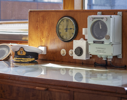 Details of a clock, dials and hat in the Chart Room. 