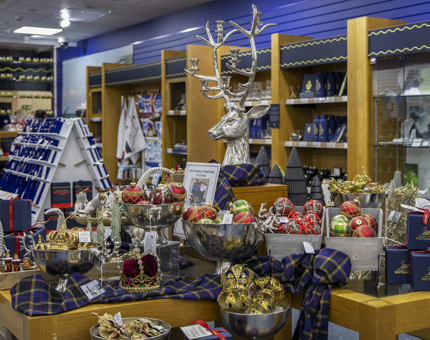 The Gift Shop's Christmas display, featuring a large silver stag statue.