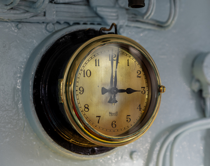 A close up of a clock in the Bridge.