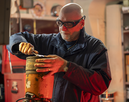 A Maintenance team member servicing a portable pump.