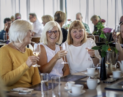 Four ladies enjoying a glass of fizz in the Tearoom. 