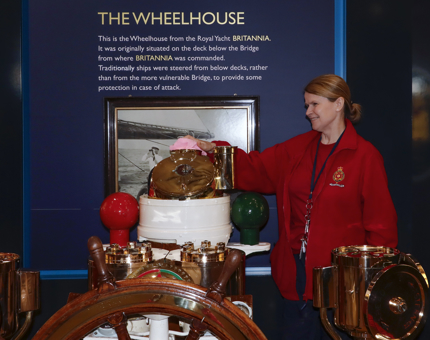 A member of the Housekeeping Team polishing the Wheel.