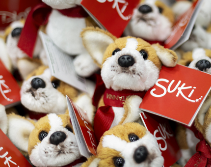 a close up of mini corgi plush toys.