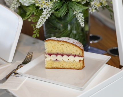 A slice of Victoria sponge cake in the Royal Deck Tearoom aboard The Royal Yacht Britannia. 