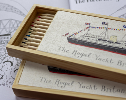 Two wooden boxes, with Britannia illustrations on them, of colouring in pencils.