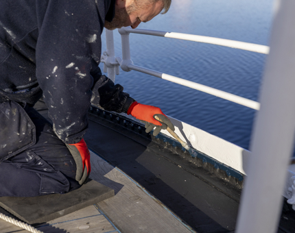 A closer look at the painting process on the Verandah Deck. 