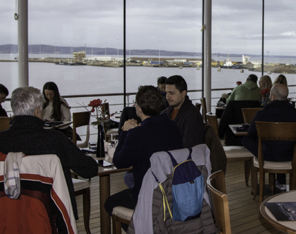 A view across the Royal Deck Tea Room of visitors sitting enjoying tea.