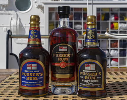 Three bottles of rum in front of the flag locker.