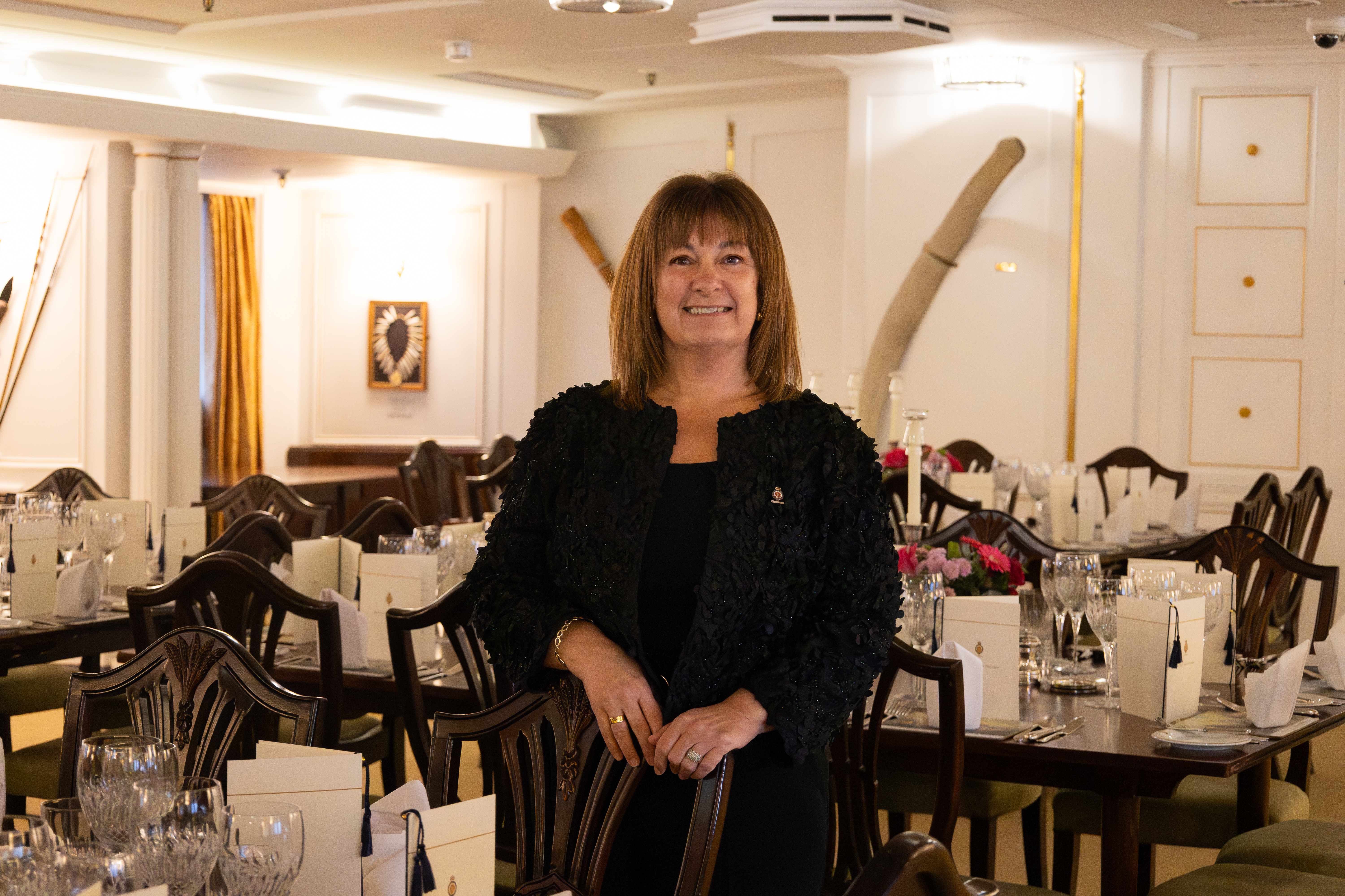 Woman at dining table for portrait.