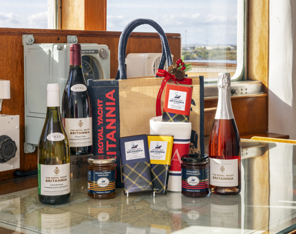 A Luxury Christmas Hamper, available from Britannia's Shop, with bottles of wine, chocolate and jars of jam. 