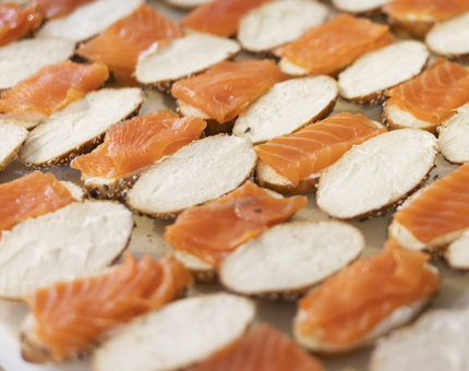 Salmon and cream cheese rolls being prepared. 