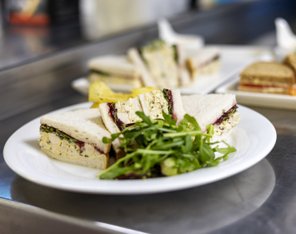 A chicken sandwich on a plate ready to be served in the Royal Deck Tearoom. 