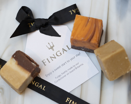 three pieces of fudge with a Fingal label. 