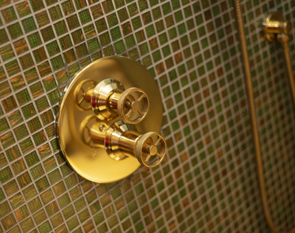 A close up of brass shower tap - nautical details aboard Fingal. 
