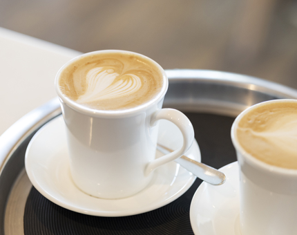 Two Lattes on a tray ready to be served in the Tearoom.