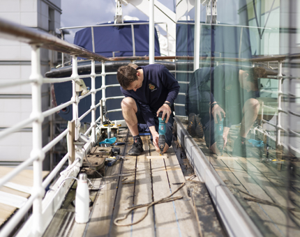  A Maintenance team member working on the deck outside the Royal Deck Tearoom. 