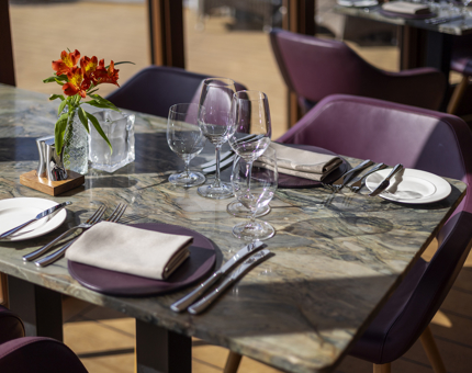 In The Lighthouse Restaurant aboard Fingal Hotel in Leith, a table is set for dinner. 