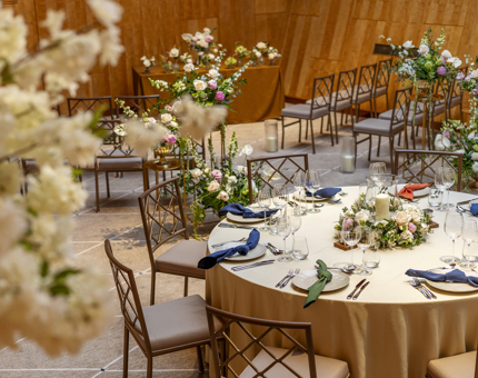 The Ballroom on Fingal with the tables set with white tablecloths and flowers for a wedding. 