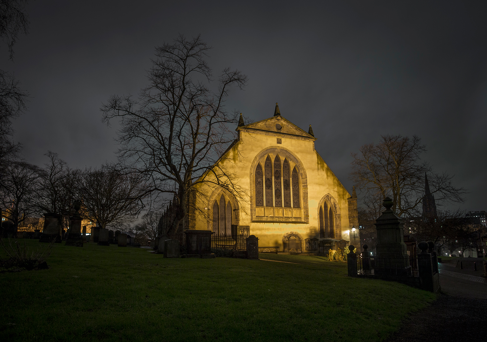 Greyfriar's Kirk in Edinburgh. It is night time but the church is lit up.