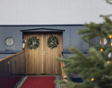 Fingal Hotel's entrance doors adorned with Christmas wreaths. 