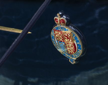 A close up of a crest on the Royal Barge.