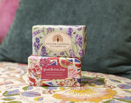 Two bars of soap in floral packaging. 