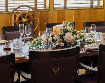The table in the Bridge aboard Fingal is set up for a wedding. 
