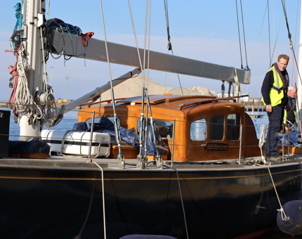 Two men aboard Royal Racing Yacht, Bloodhound. 