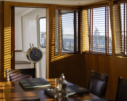The Bridge aboard Fingal Hotel. There is sunlight streaming through the window. 