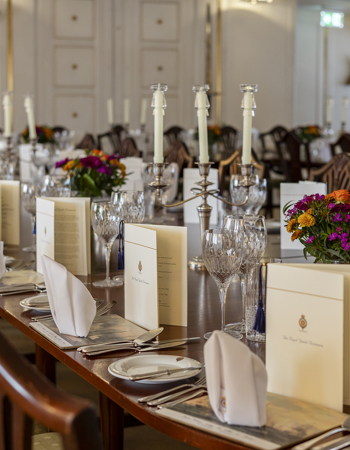 The State Dining Room table is set for an evening event on board. 