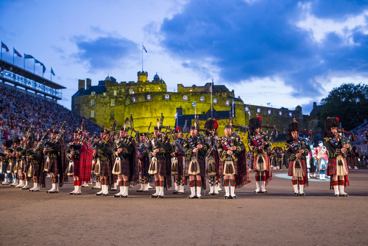 Edinburgh Castle is in the background with Pipers lined up in the foreground at the Royal Edinburgh Military Tattoo.
